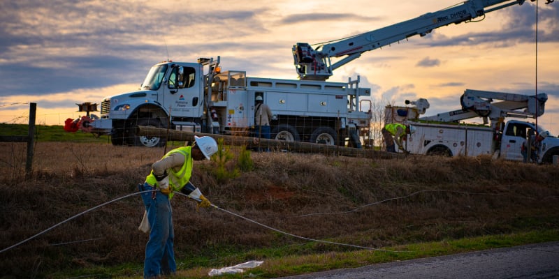 Alabama Power crews work to restore power in a rural area